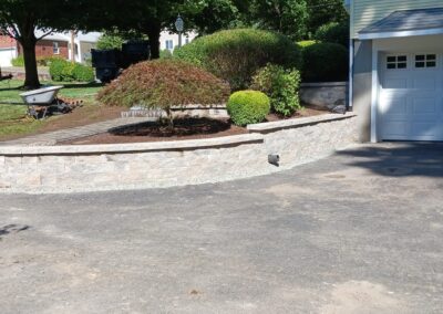 Retaining Wall Build Services in Watertown, CT by Riley Tree and Landscaping, LLC.